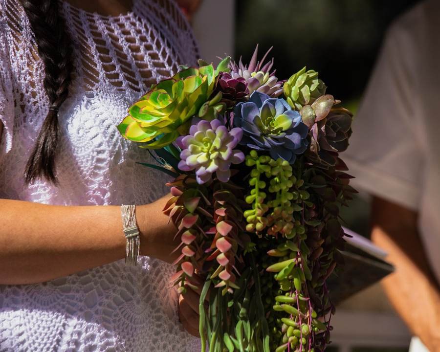 Close up of a succulent wedding bouquet in warm light