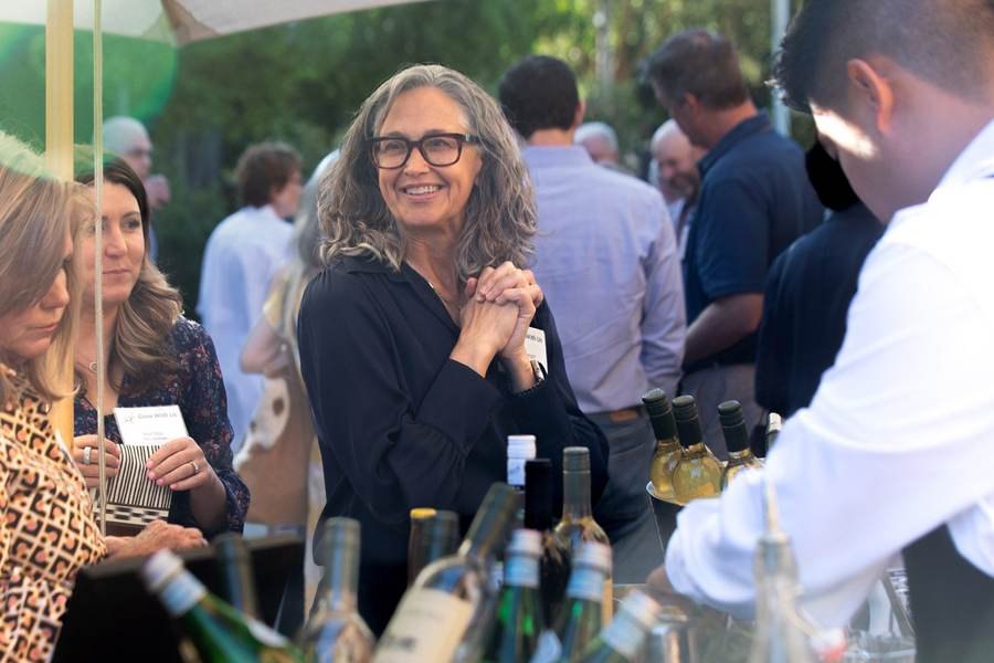Guest smiling at an outdoor nonprofit fundraiser event